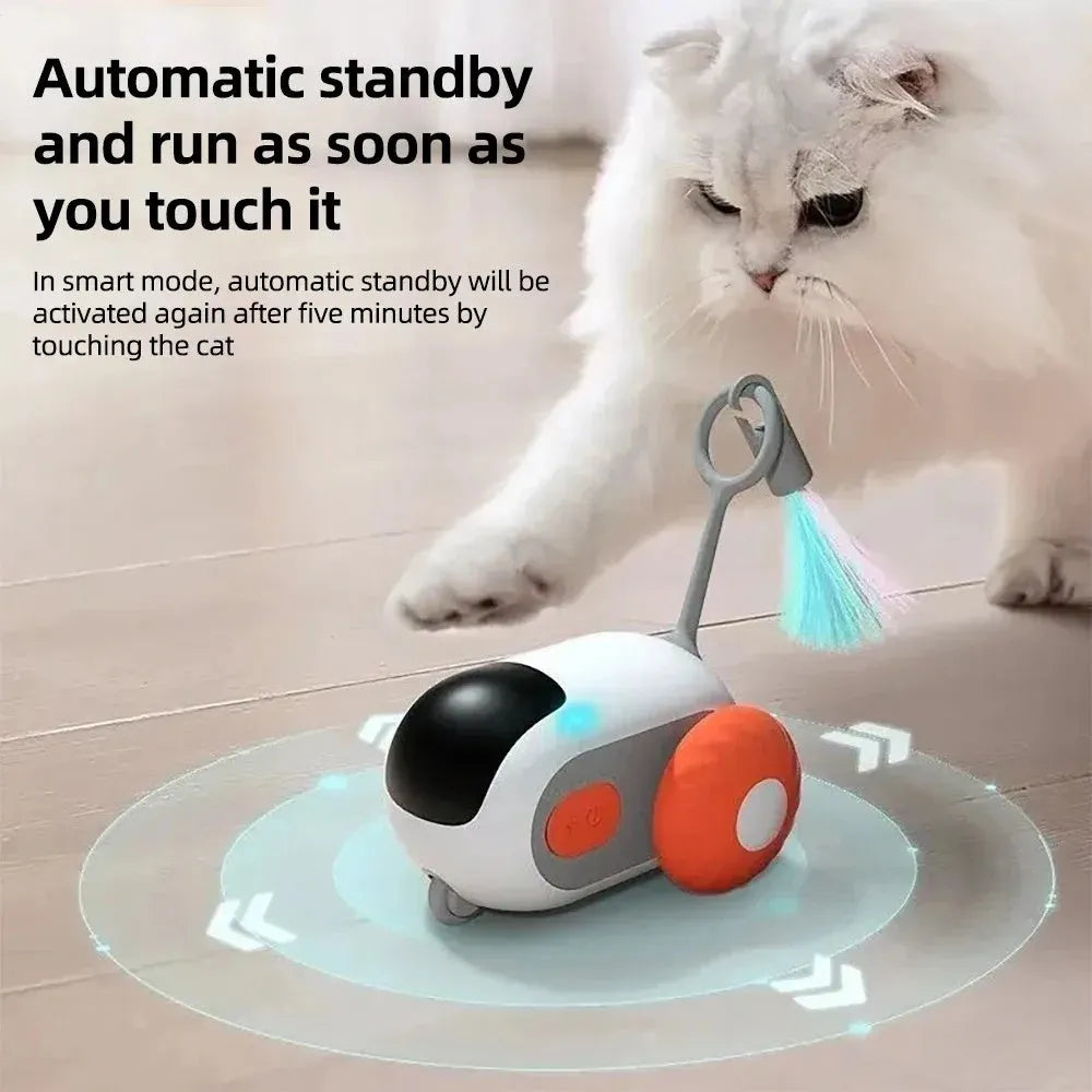 Blue remote controlled smart cat toy car with feather teaser attachment on hard floor