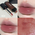 Black shiny mirror lip lacquer cosmetic product showing six colour options including deep reds and browns