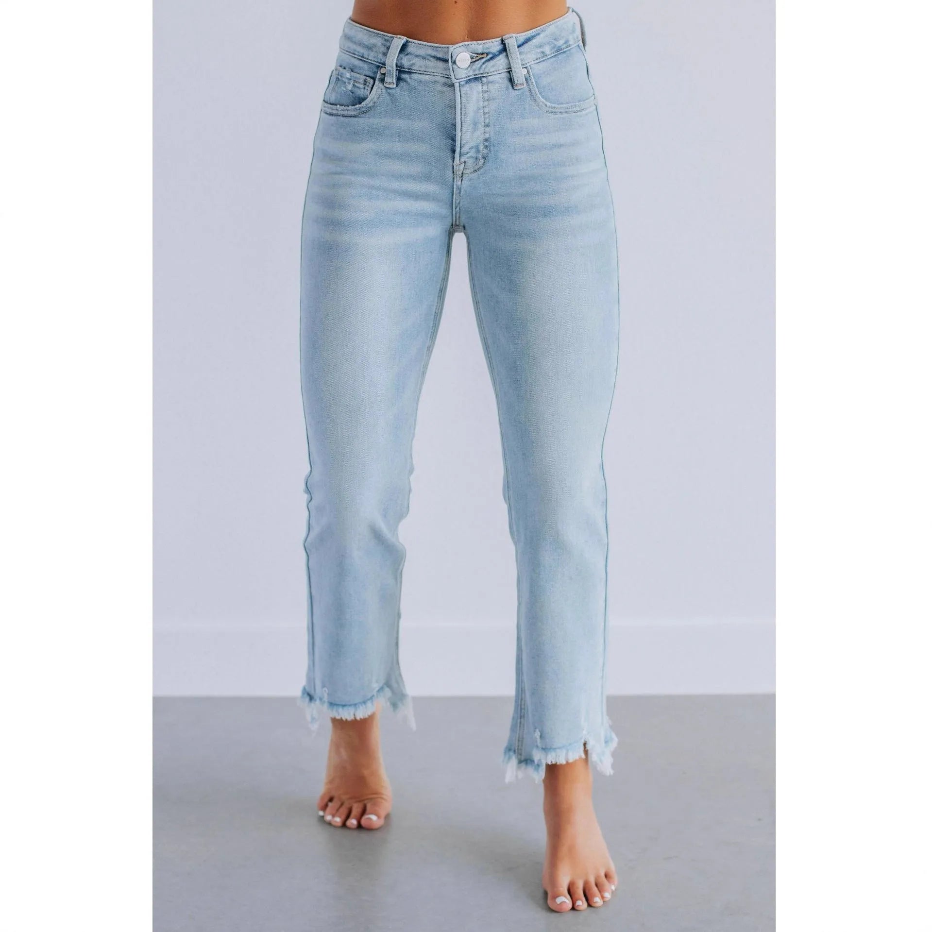 Women's solid colour denim jeans with hand-sanded distressing in dark blue and light blue colour options