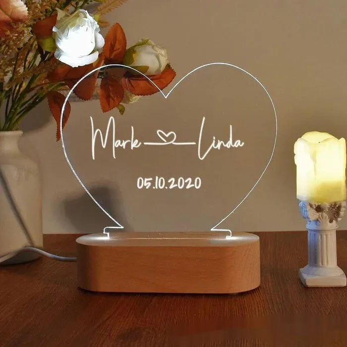 Custom transparent acrylic night light with LED base showing personalised engraving, dimensions 20cm by 11.5cm.