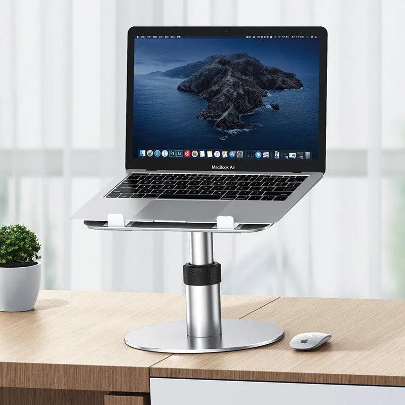 Aluminium car laptop stand in silver, showing adjustable height and rotating base with non-slip silicone pads.