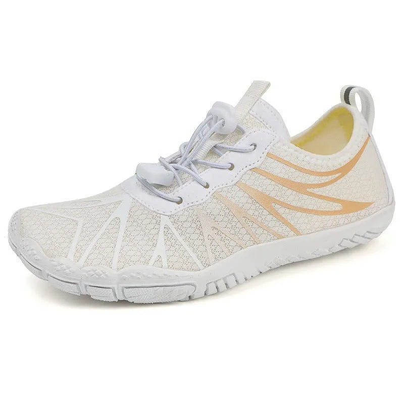 Low-top unisex casual sports running shoe in multiple colours with a lace-up front and rubber sole.