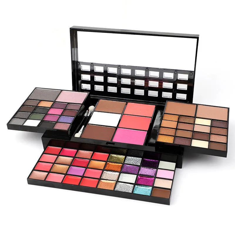 74-colour makeup palette open showing eyeshadows, lip glosses, and face powders with included brushes