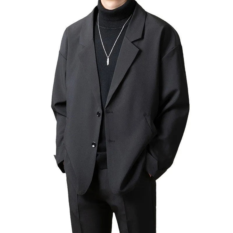 Man wearing a loose fit casual suit jacket in a light business style, available in apricot colour.