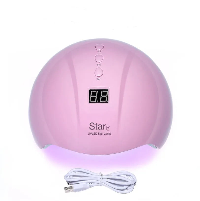 Gold acrylic number 5 LED light-up centrepiece on a table with remote control.