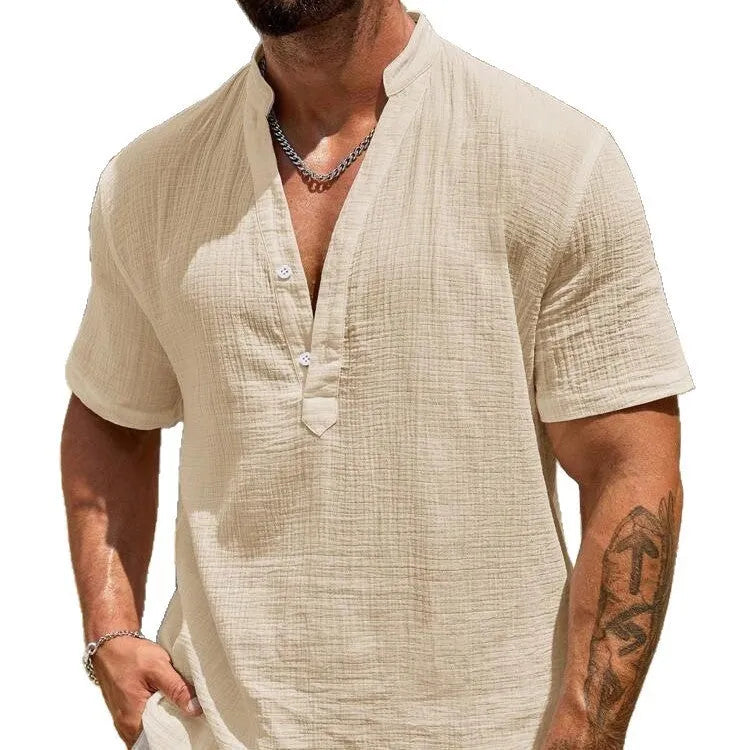 Men's solid colour stand collar short-sleeved casual shirt laid flat, showing slit detail and thin fabric.