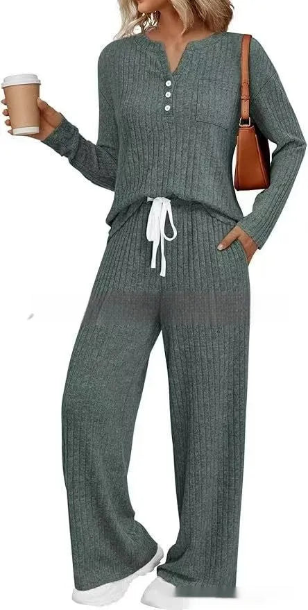 Women's striped knit V-neck long coat in light grey with matching pants, showing lace-up details