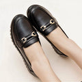 Black women's microfiber slip-on pumps with round toes and low flat heels on rubber soles