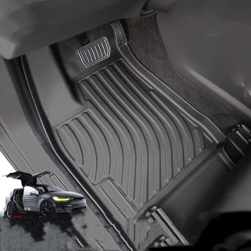 Tesla Model X black TPE rubber floor mats and boot liner set on car interior.