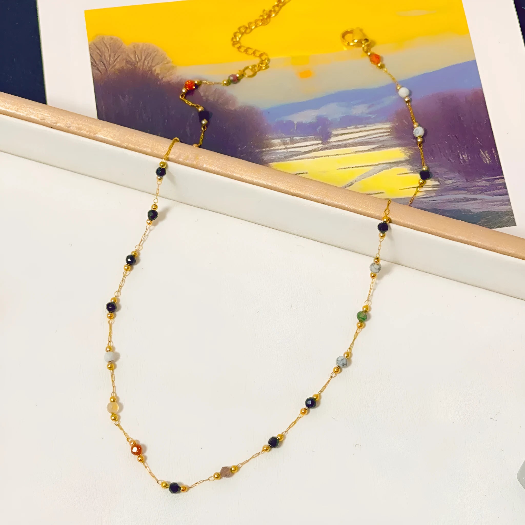 Gold titanium steel necklace with natural stone pendant on female model