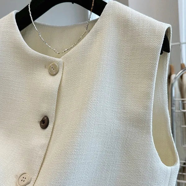 Women's milky white French-style bandage vest with round neck and sleeveless design on a hanger.