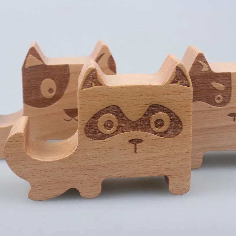 Resin mobile phone holder with beech wood animal design and coin storage compartment