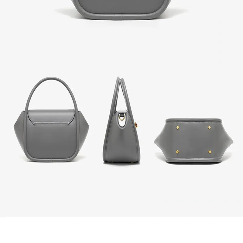 Soft cow leather wing-shaped tote handbag with a buckle and cross-body strap in four colour options.