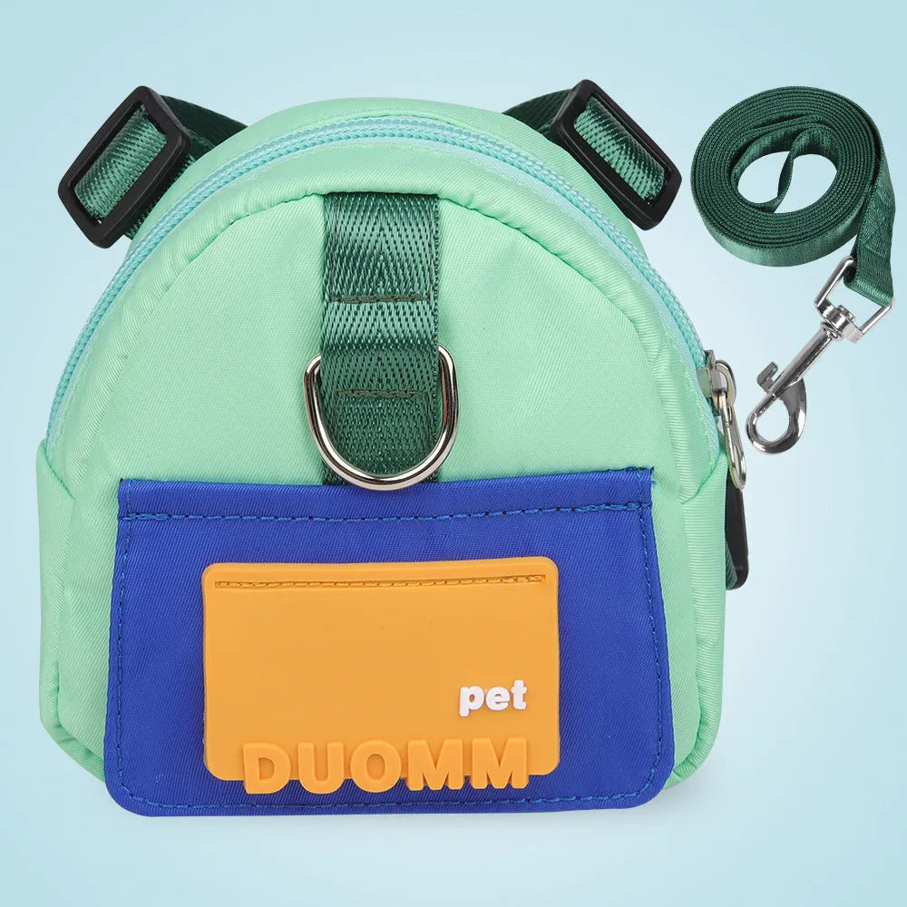 Blue adjustable dog harness backpack with storage compartment and tow rope shown on a medium-sized dog.