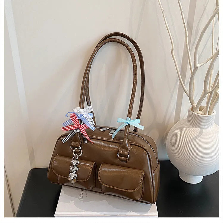 Retro pillow-shaped women's handbag in PU leather with double shoulder strap