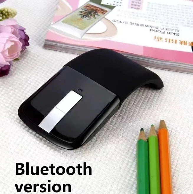 Folded Bluetooth wireless mouse showing compact 131.2mm length with touch surface and multiple colour options