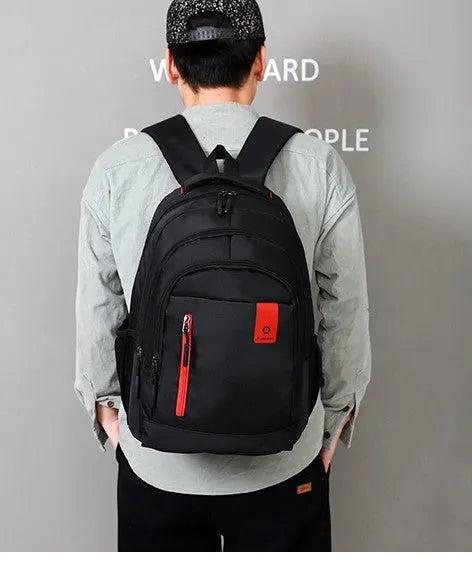 Lightweight teen backpack in blue with sponge-padded shoulder straps and side zipper pockets.