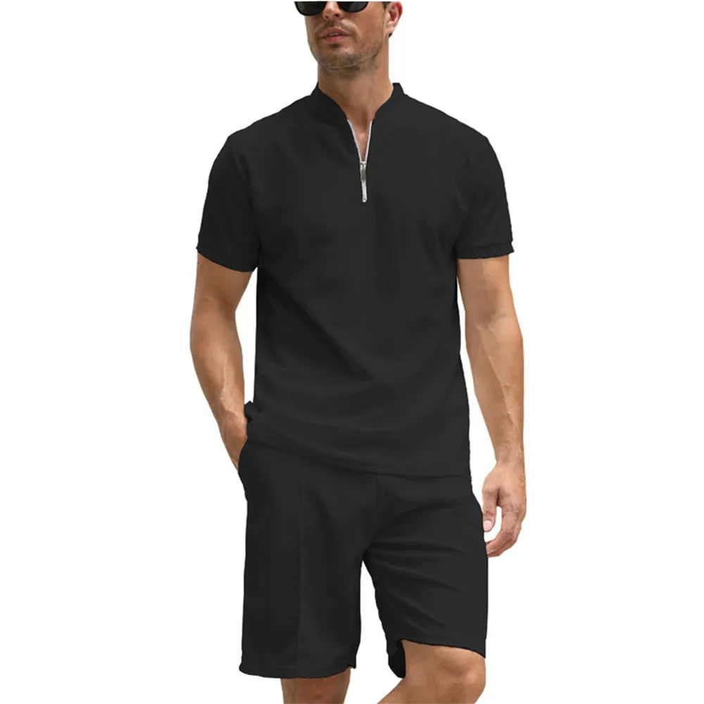 Men's solid colour short sleeve polo shirt and matching trousers two-piece set on a hanger.