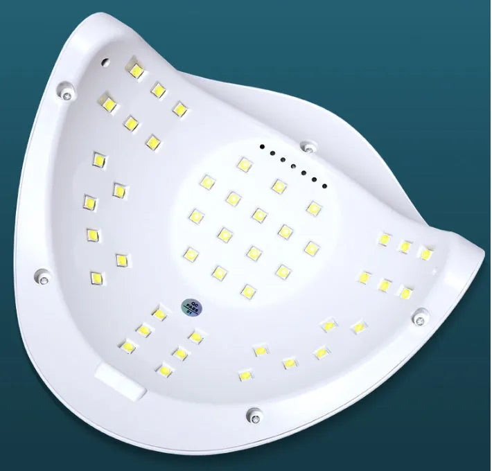 White nail polish curing lamp with UV and LED light sources for gel manicures