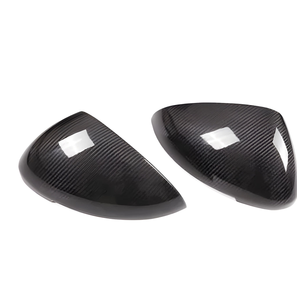 True carbon fibre rearview mirror cover for Porsche Macan, showing black woven pattern.