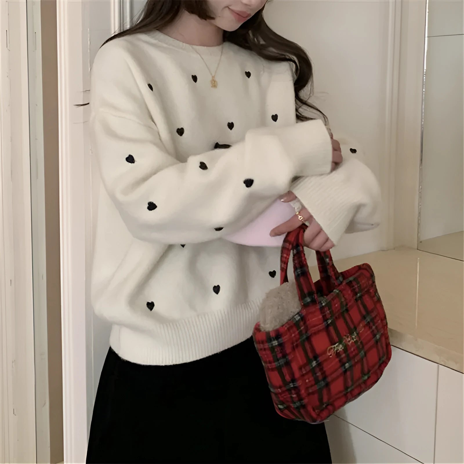 Women's loose fit long sleeve acrylic pullover sweater with love embroidery in milky white.