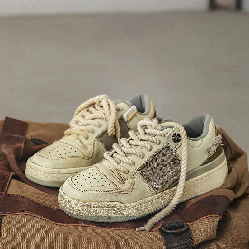 Beige low-top vintage skateboard shoes with round toe and rubber sole