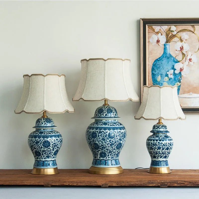 Handmade blue and white Chinese porcelain ceramic table lamp with copper base and fabric shade.