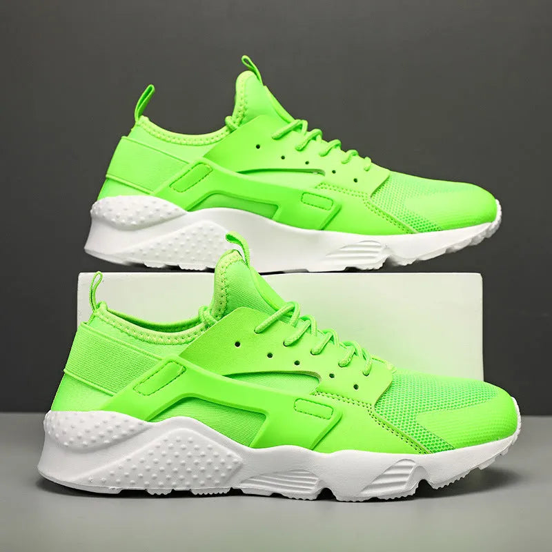 Men's green low top mesh casual shoes with lace-up front and cross shoulder straps on a flat MD sole