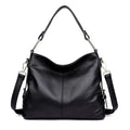 Square vertical genuine leather crossbody bag with multiple internal zipper compartments.