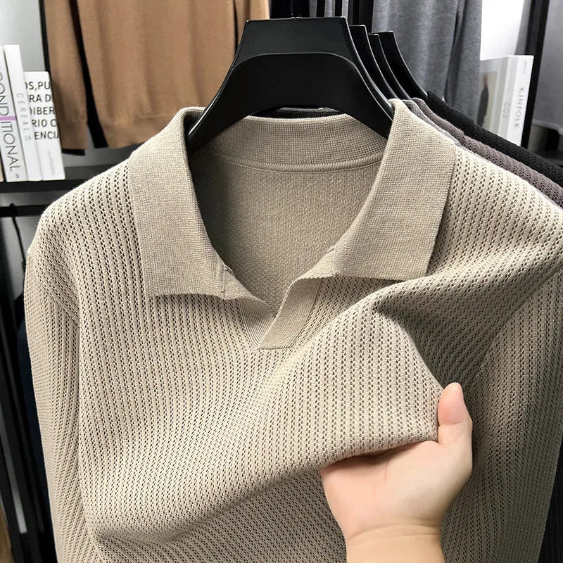 Man wearing a loose-fit green casual pullover sweater for autumn leisure.