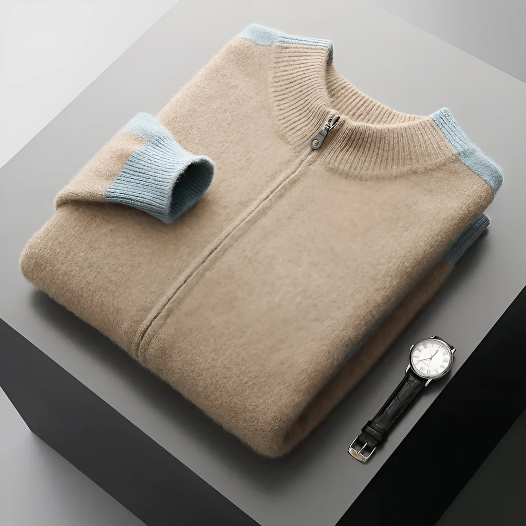 Man wearing a dark blue half turtleneck zipper cardigan made of thick rough wool yarn.