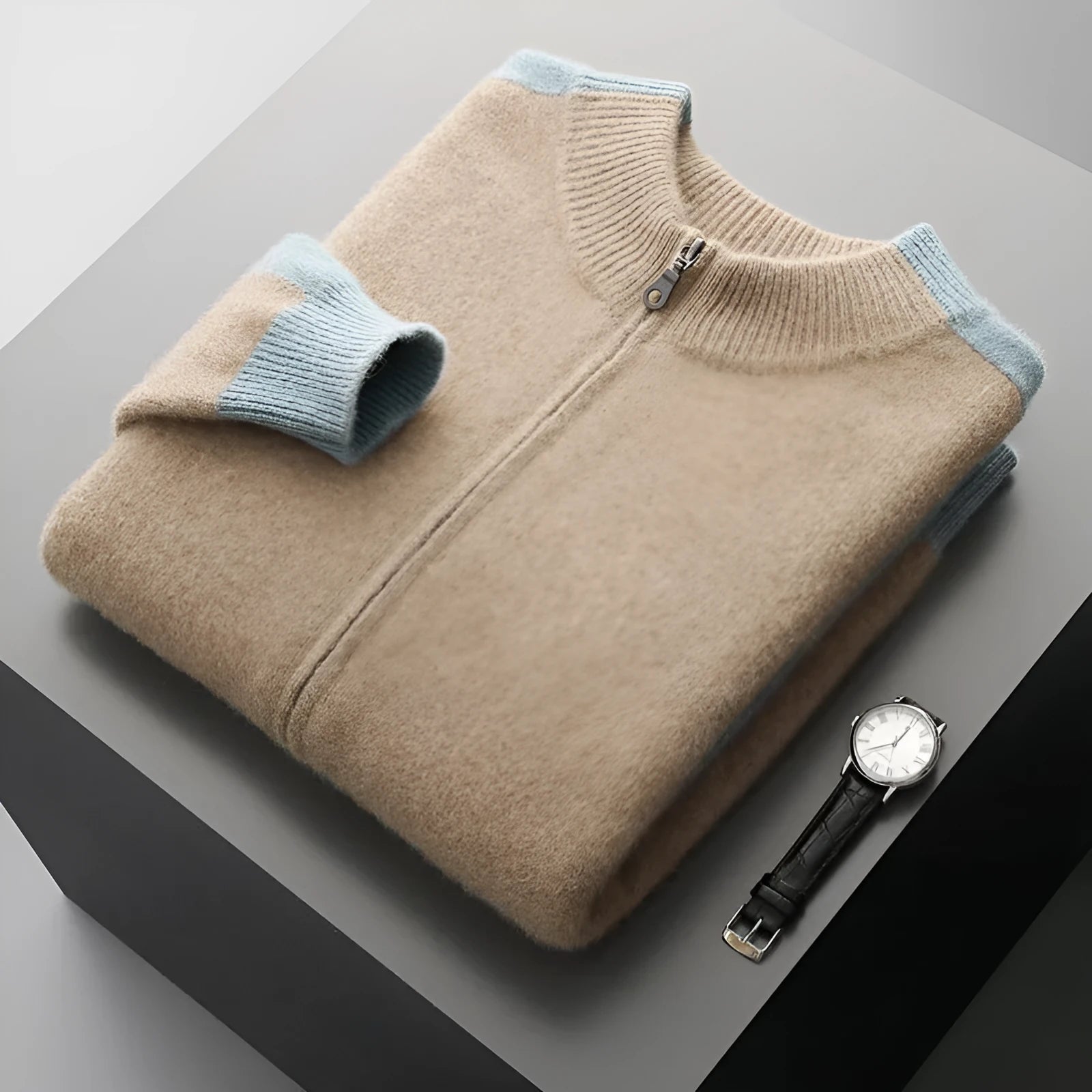 Man wearing a dark blue half turtleneck zipper cardigan made of thick rough wool yarn.