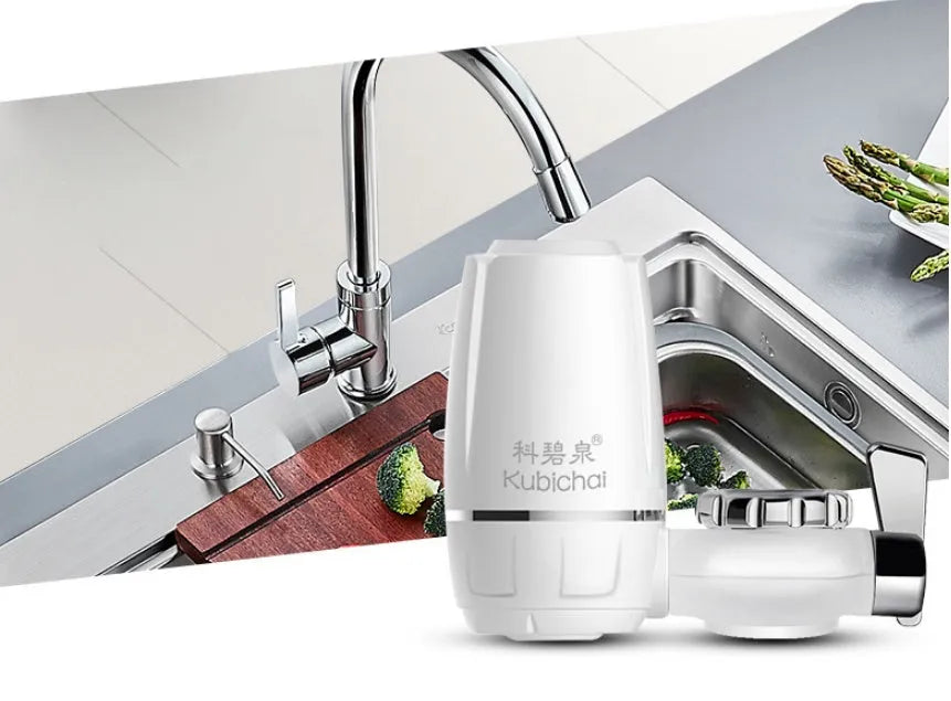 White plastic faucet-mounted water filter with ceramic cartridge and tap adapters