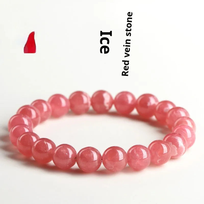 Women's red rhodochrosite crystal bracelet with geometric pattern and longevity lock clasp showing natural stone variations