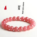 Women's red rhodochrosite crystal bracelet with geometric pattern and longevity lock clasp showing natural stone variations