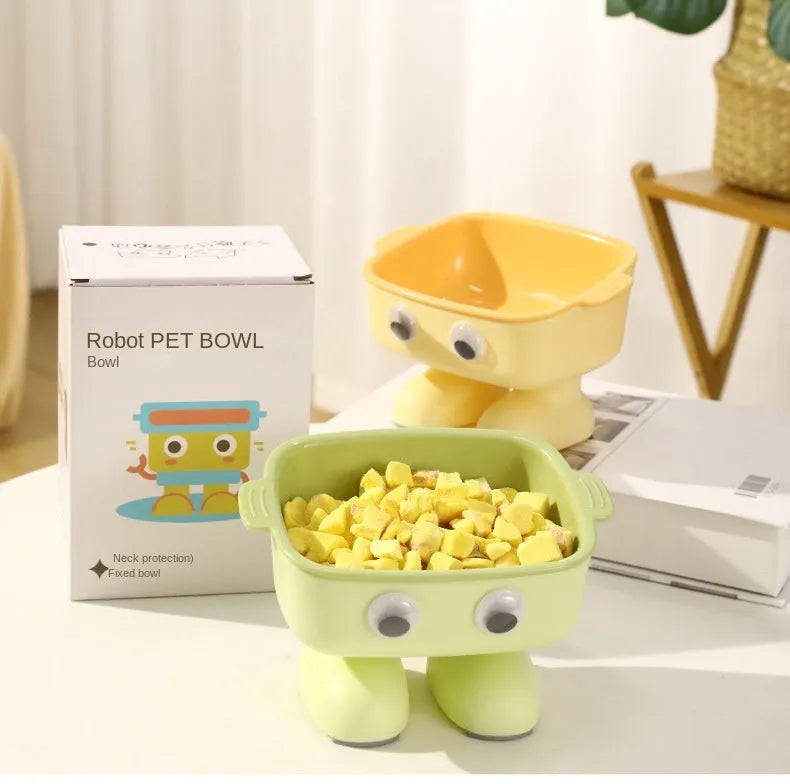 Green robot-shaped elevated cat bowl with tilted design and detachable inner component