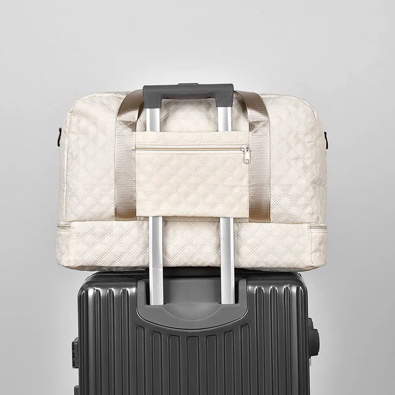 Large Oxford cloth travel bag with 36-55 litre capacity shown in haze blue colour