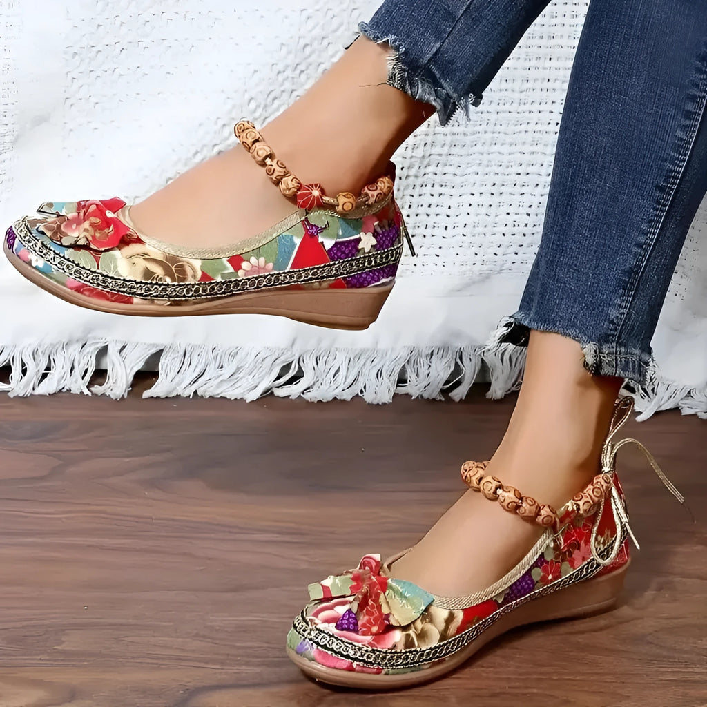 Women's plus size black ethnic platform sandals with elastic band and cloth upper.