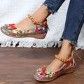 Women's plus size black ethnic platform sandals with elastic band and cloth upper.