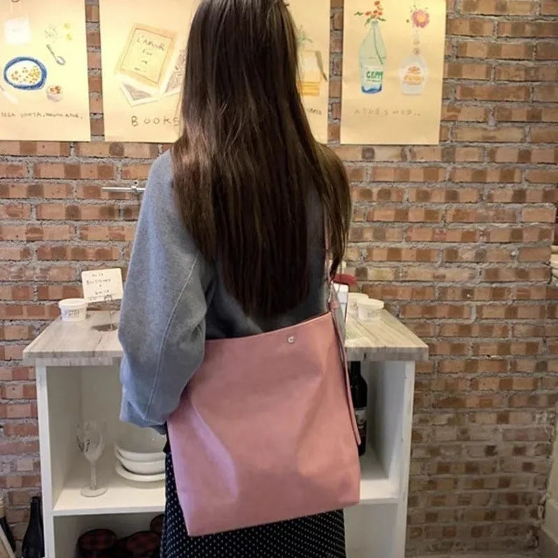 Corduroy one-shoulder commuter bag in pink with PU-lined interior