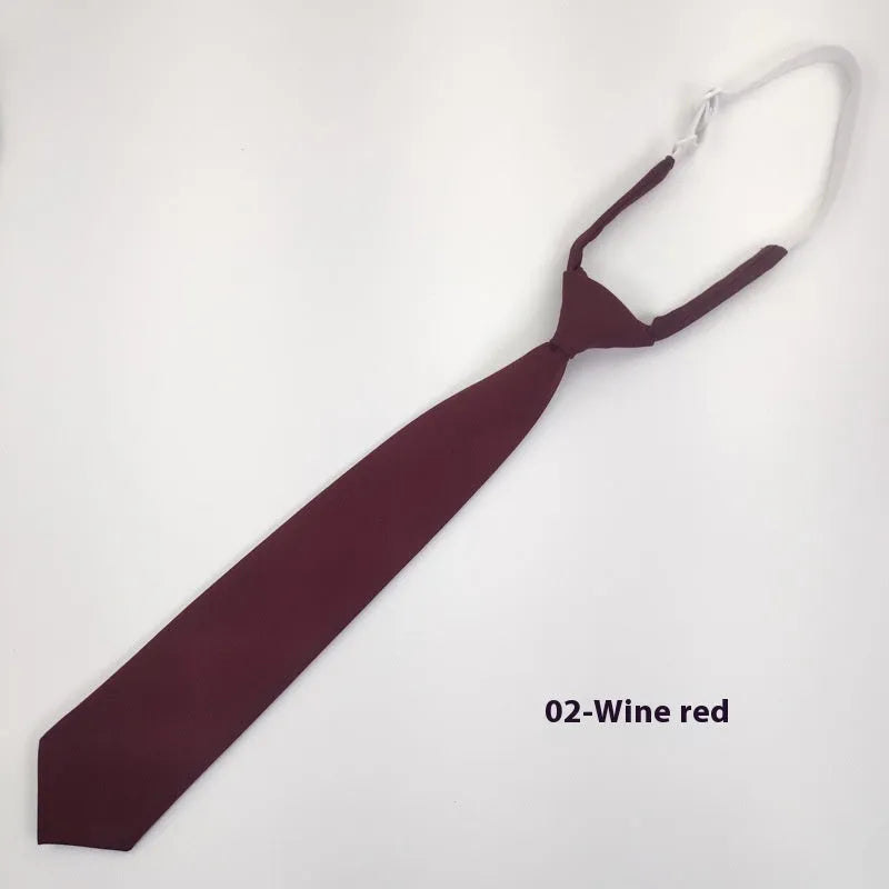 Men's navy blue cotton bow tie with arrow-style design on a white background.
