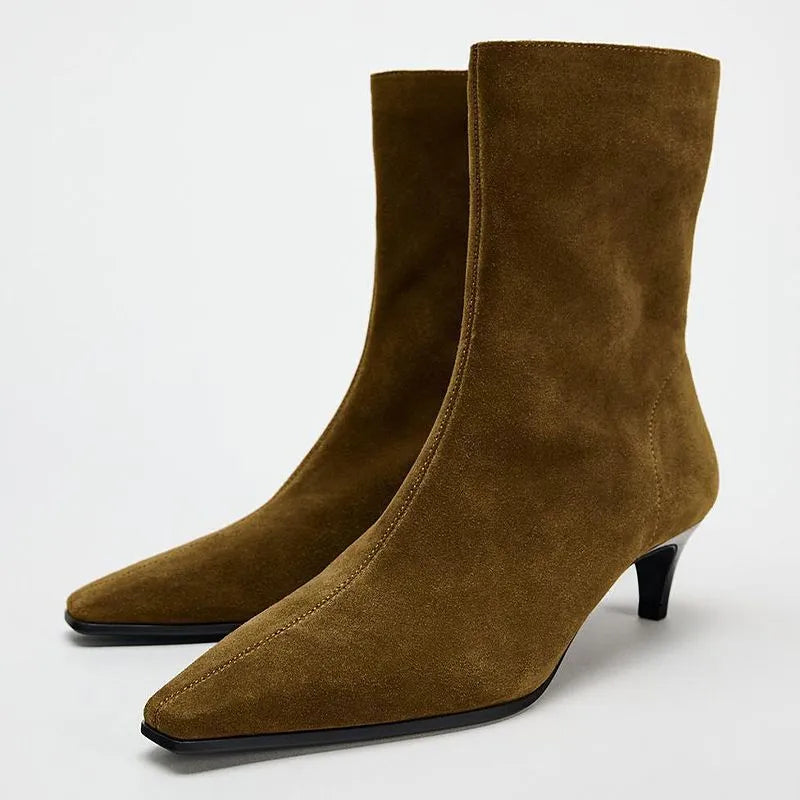 Brown square toe mid calf boots with a kitten heel and side zipper on a white background.