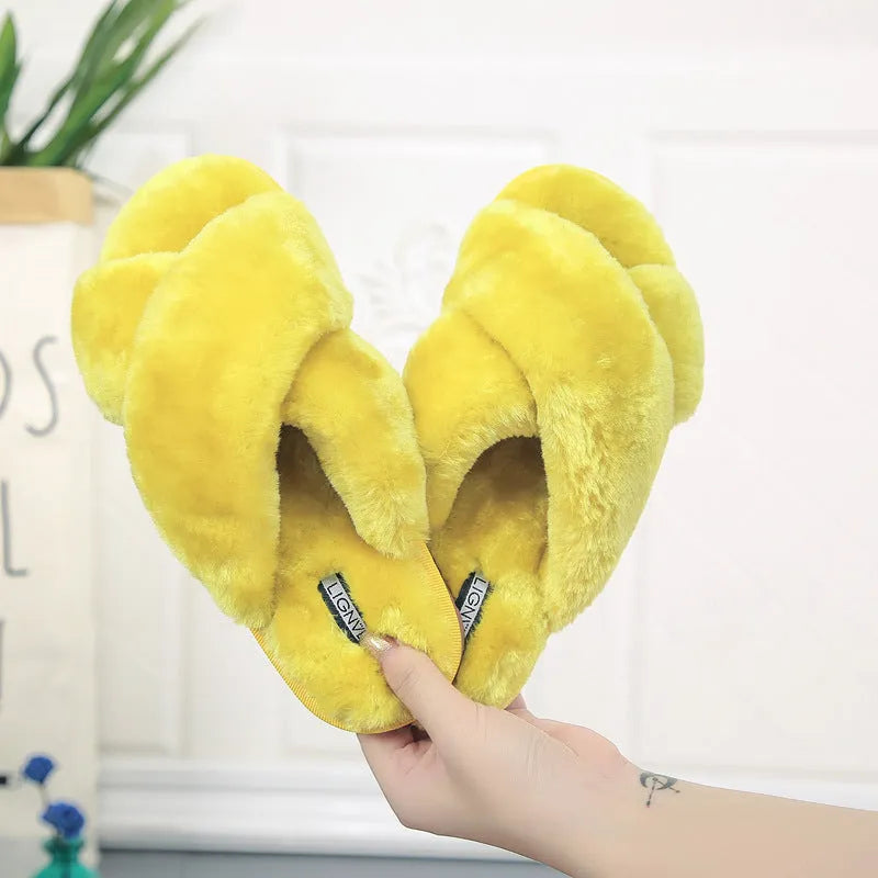 Cross strap open-toe fur slippers in multiple colours on a non-slip rubber sole.