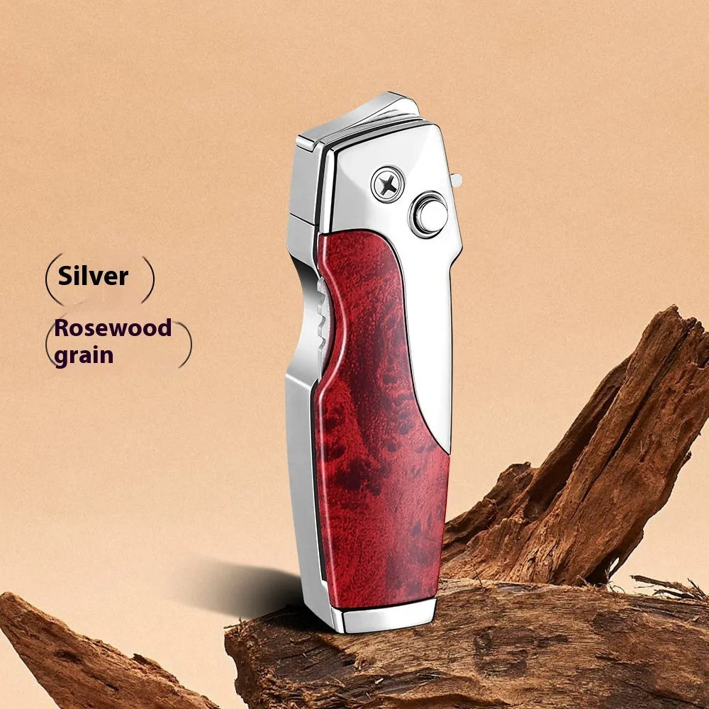 Zinc alloy folding lighter tool with integrated knife in a black wood grain finish.