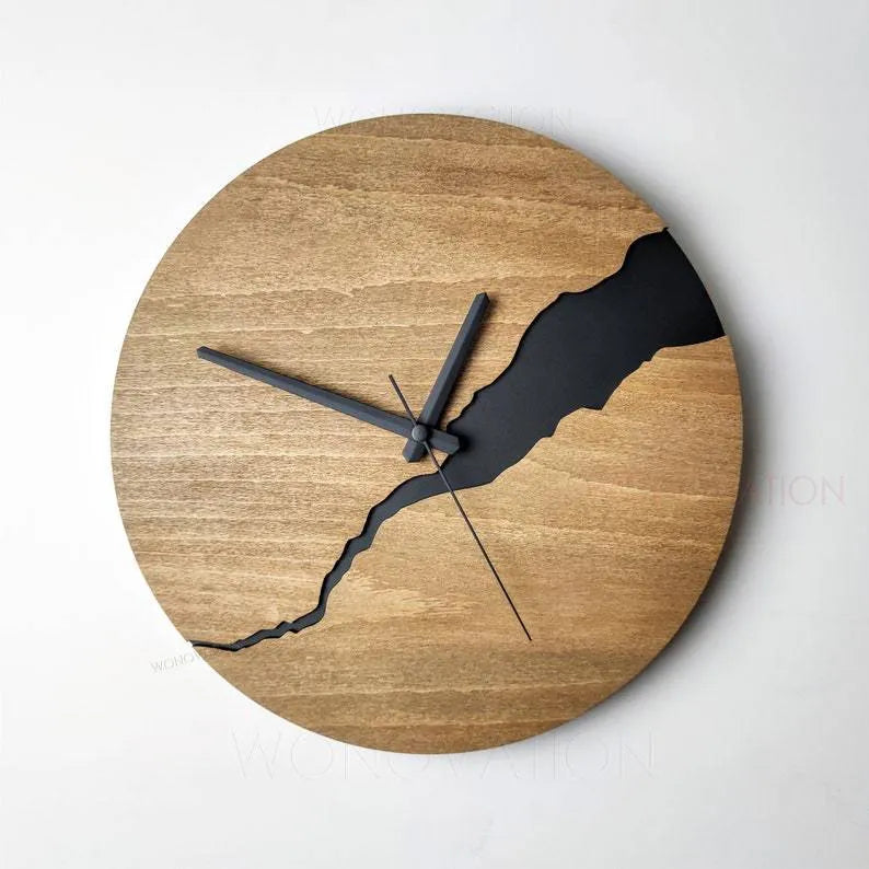 Modern simple wooden wall clock with Arabic numerals on face, shown in a neutral colour finish.