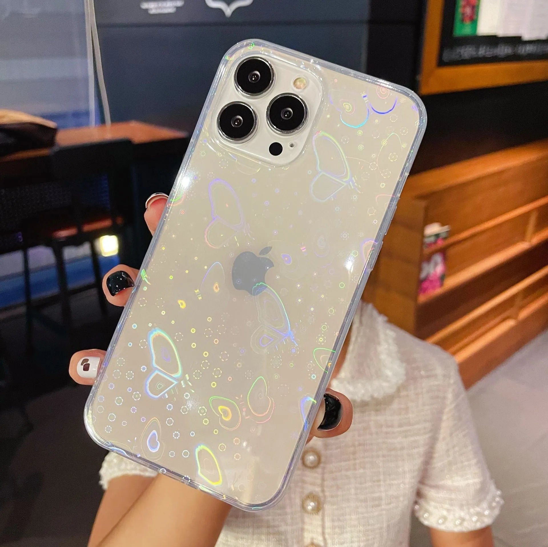 Transparent silicone iPhone case with a colourful laser love heart design.