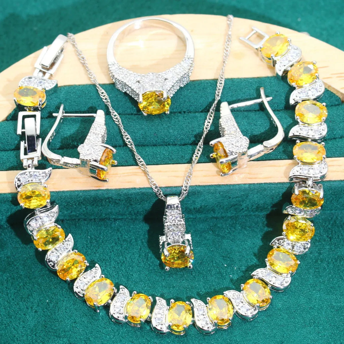Bridal zircon four-piece jewellery set with necklace, earrings, bracelet, and ring in water wave chain style.