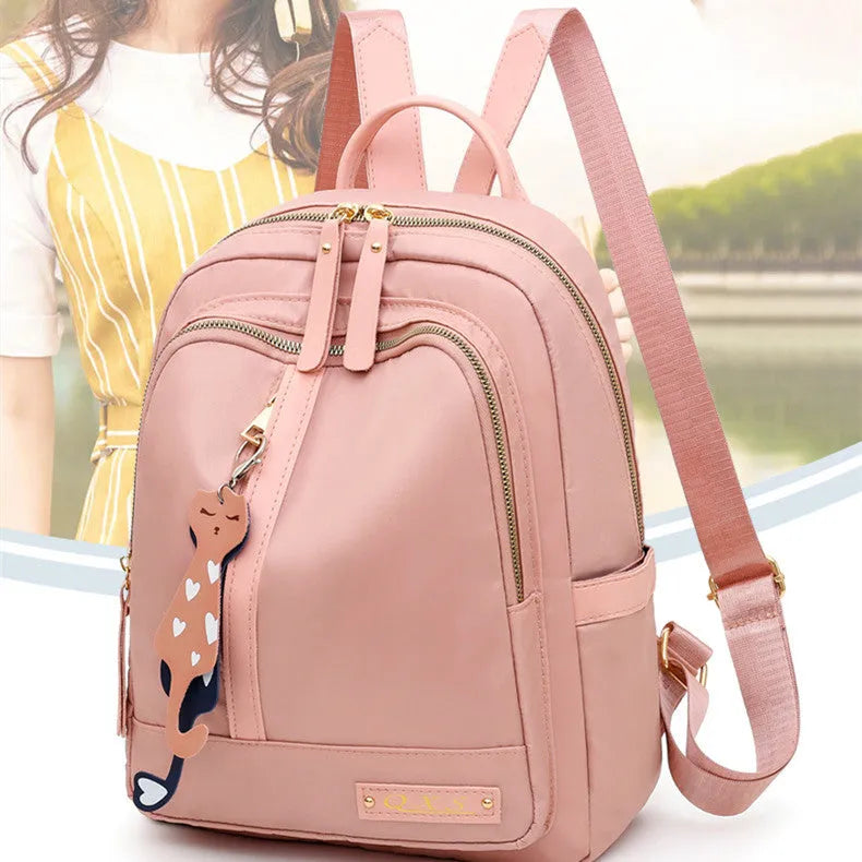 Women's black nylon casual backpack with multiple compartments and double shoulder straps