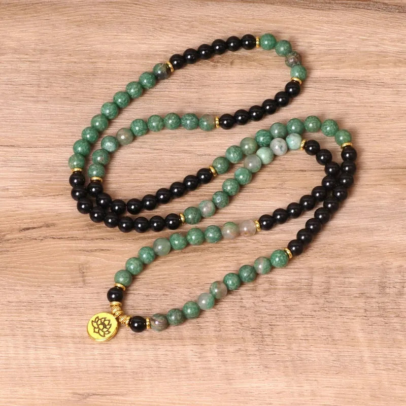 Green and black elastic beaded alloy bracelet with natural styling