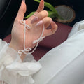 White sweet bow pearl necklace for women with adjustable length and geometric centrepiece